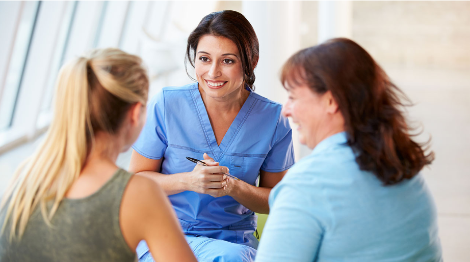 doc conversing with adult patient